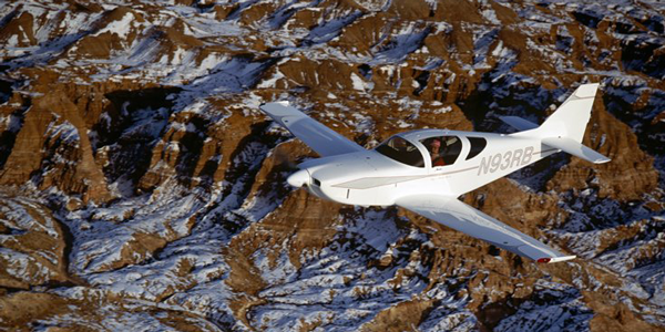 Ray Batson “in the office” after retirement from the USGS—the cockpit of the  Sudden Snowflake, Glasair III N93RB, over the Echo Cliffs, Arizona.  Photo by Rhoda Batson.